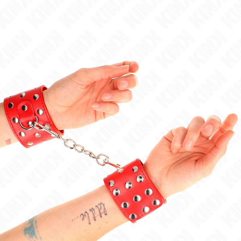 Handfesseln mit Druckknopfverschluss voller roter Nieten verstellbar 19-24 cm x 5,5 cm